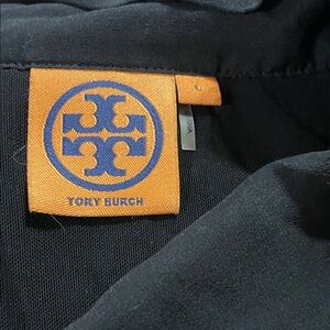 Tory Burch Black Attire with Orange and Blue Logo